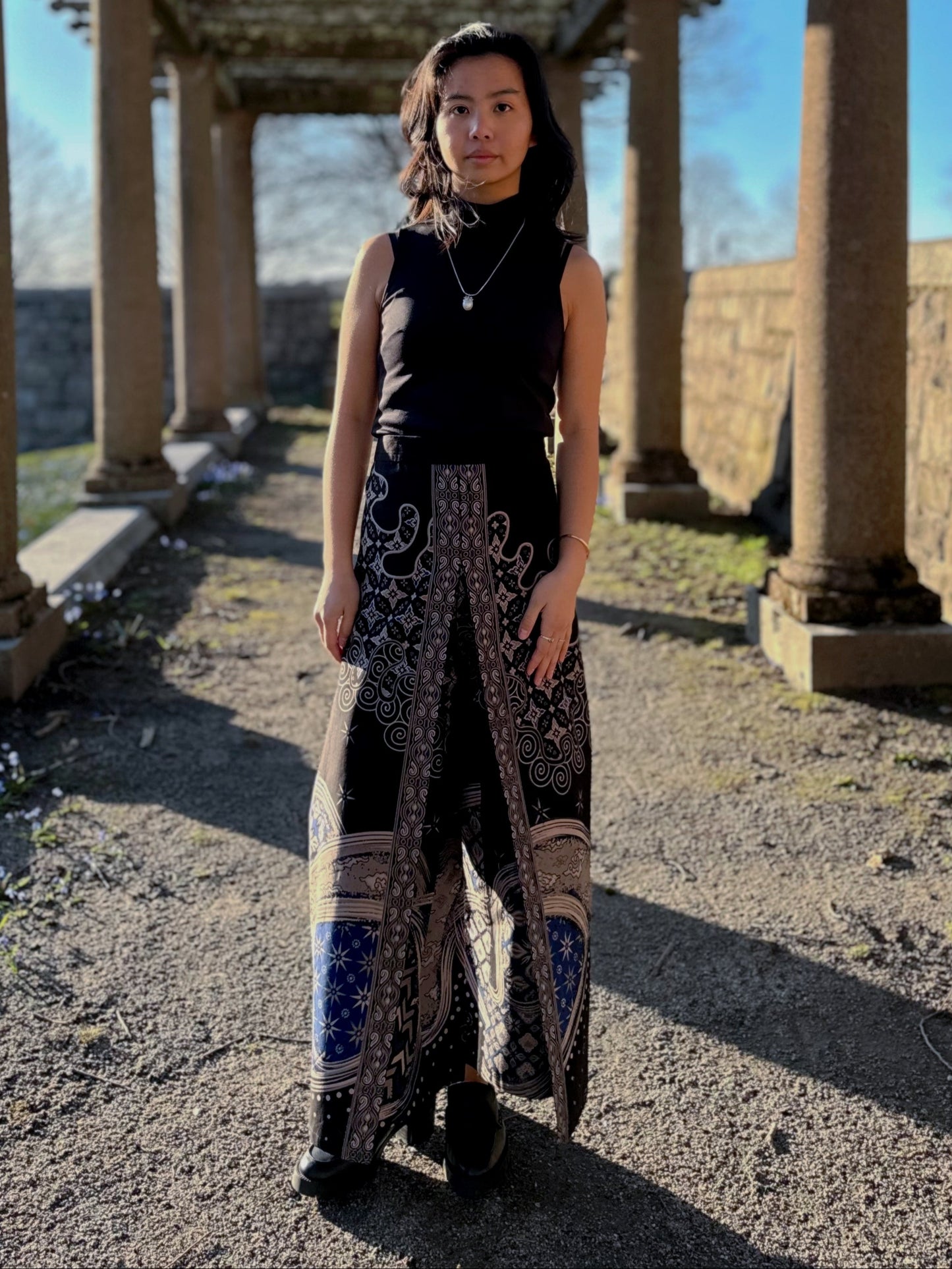 Model wearing the Avery pants in black by Mutiara Heritage.