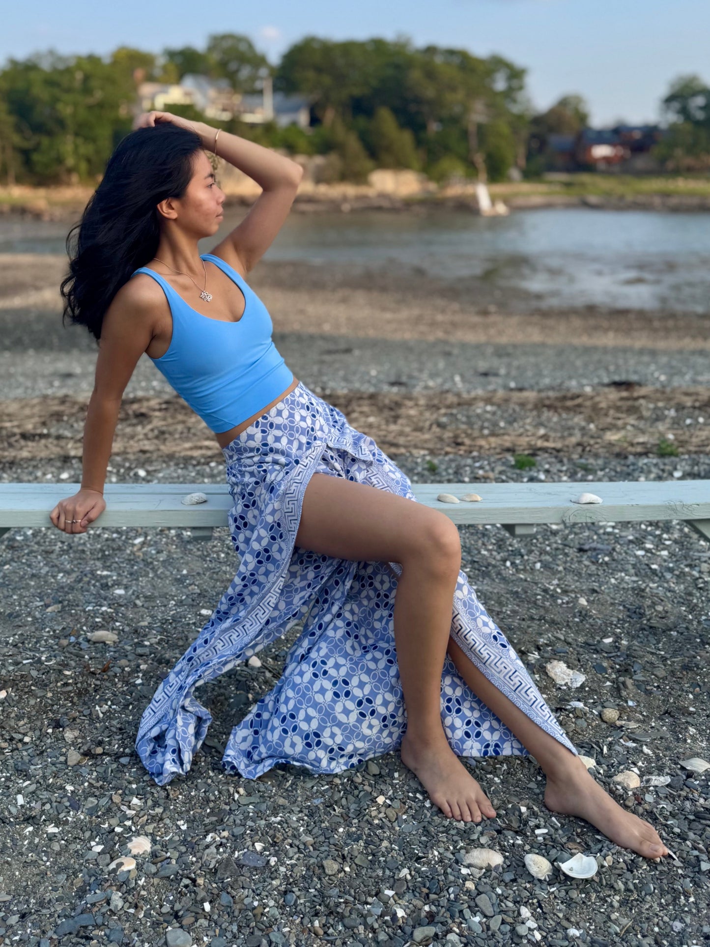 Side view of high slit beach pants in light blue.