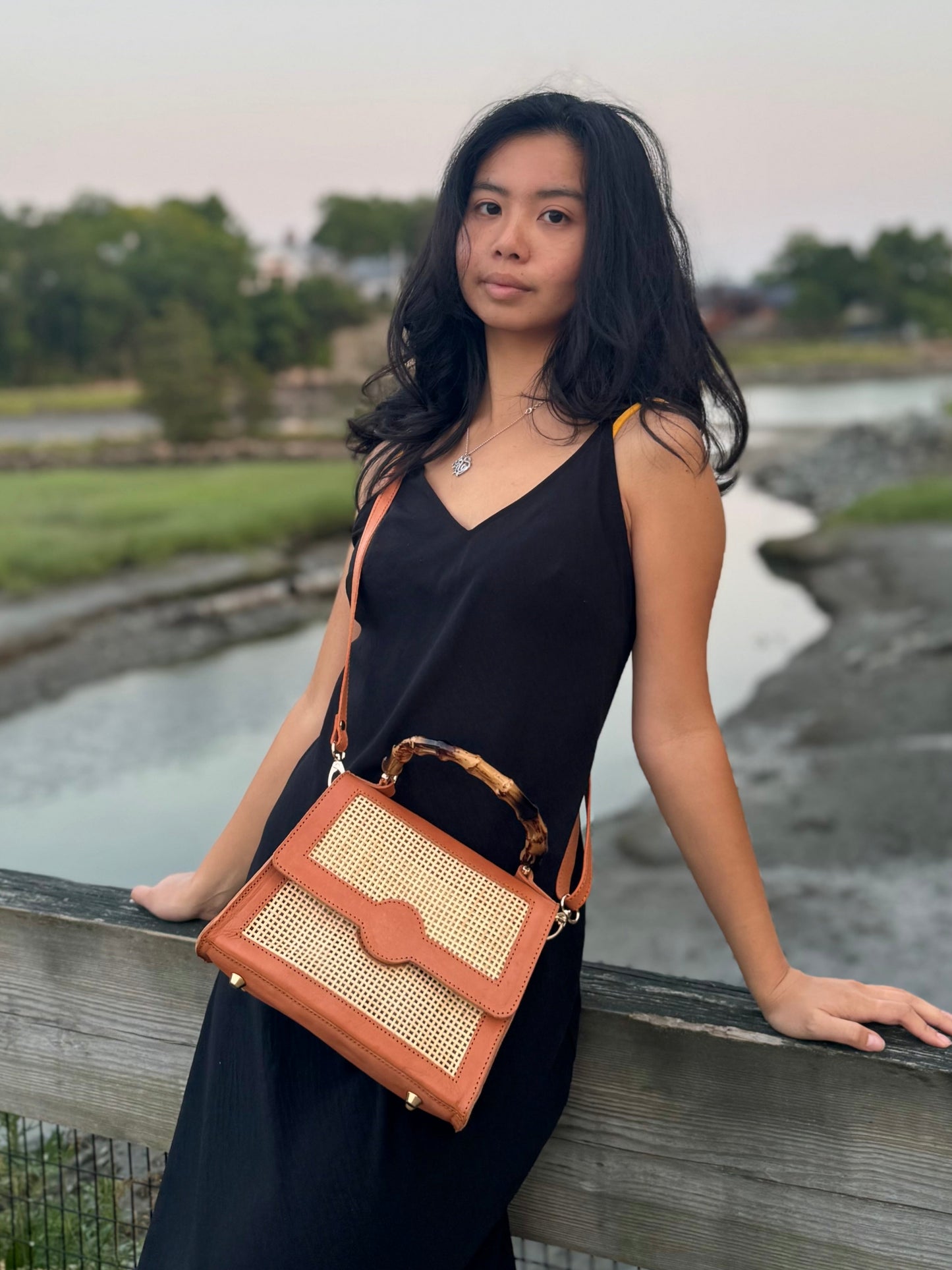 Model wearing Maya bag as a crossbody bag.
