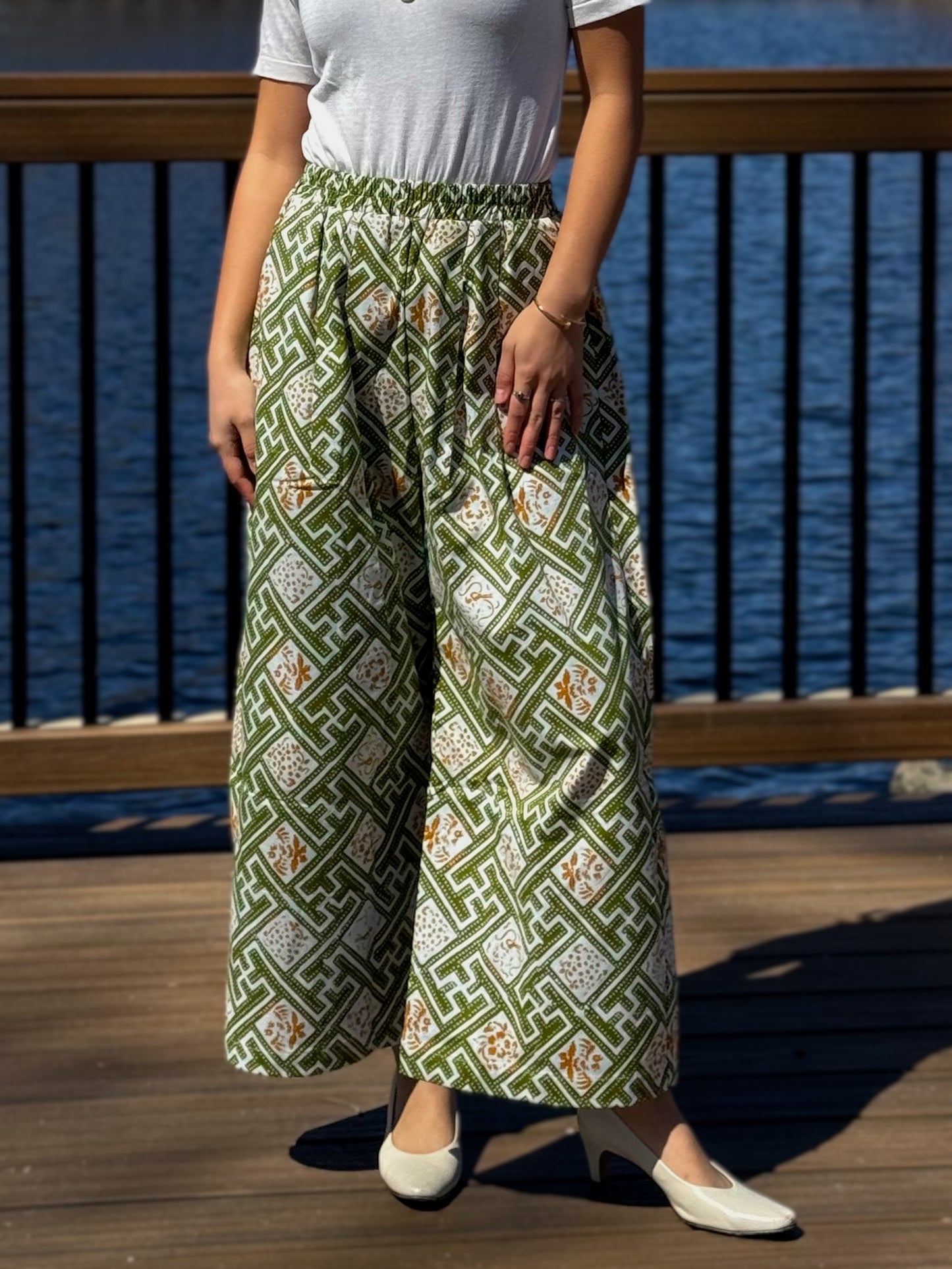 Front view of Nami barrel pants in light green