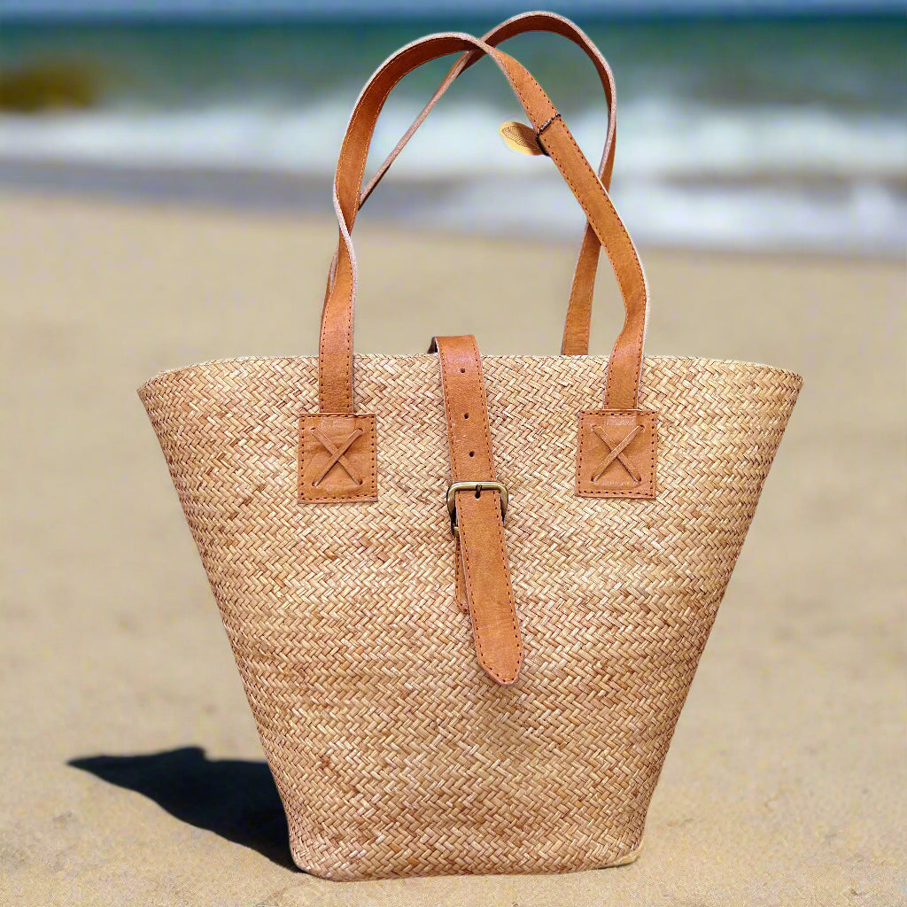 Sari Beach bag photographed with a beach background.