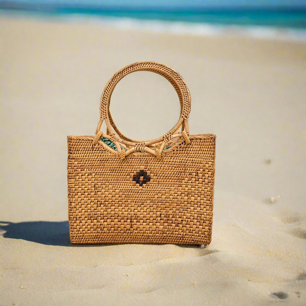 Rattan ata vine bag placed on a beach
