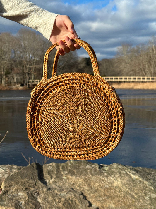 A top handle bag made of rattan