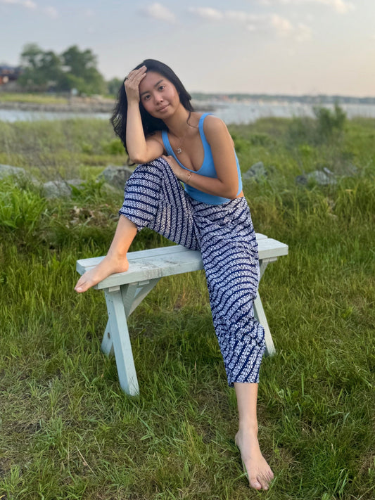 Model posing wearing a black dewi yoga pants 