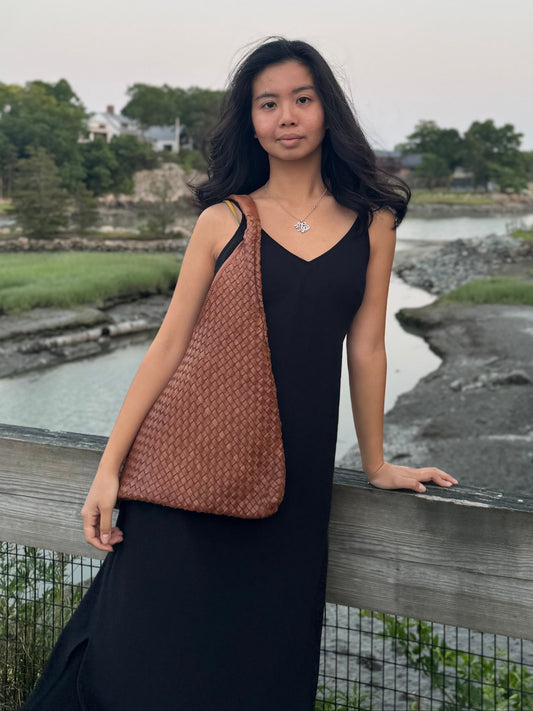 Model showing the front profile of Giana Leather Bag