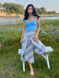 Front view of blue-patterned Hanna Capri Pants with Wrap style slit design 