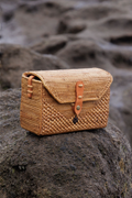 Isla messenger bag shot on a rock