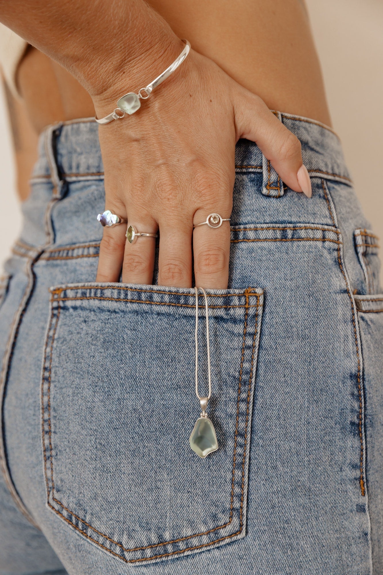 Lifestyle image of a series of jewelry by Mutiara Heritage