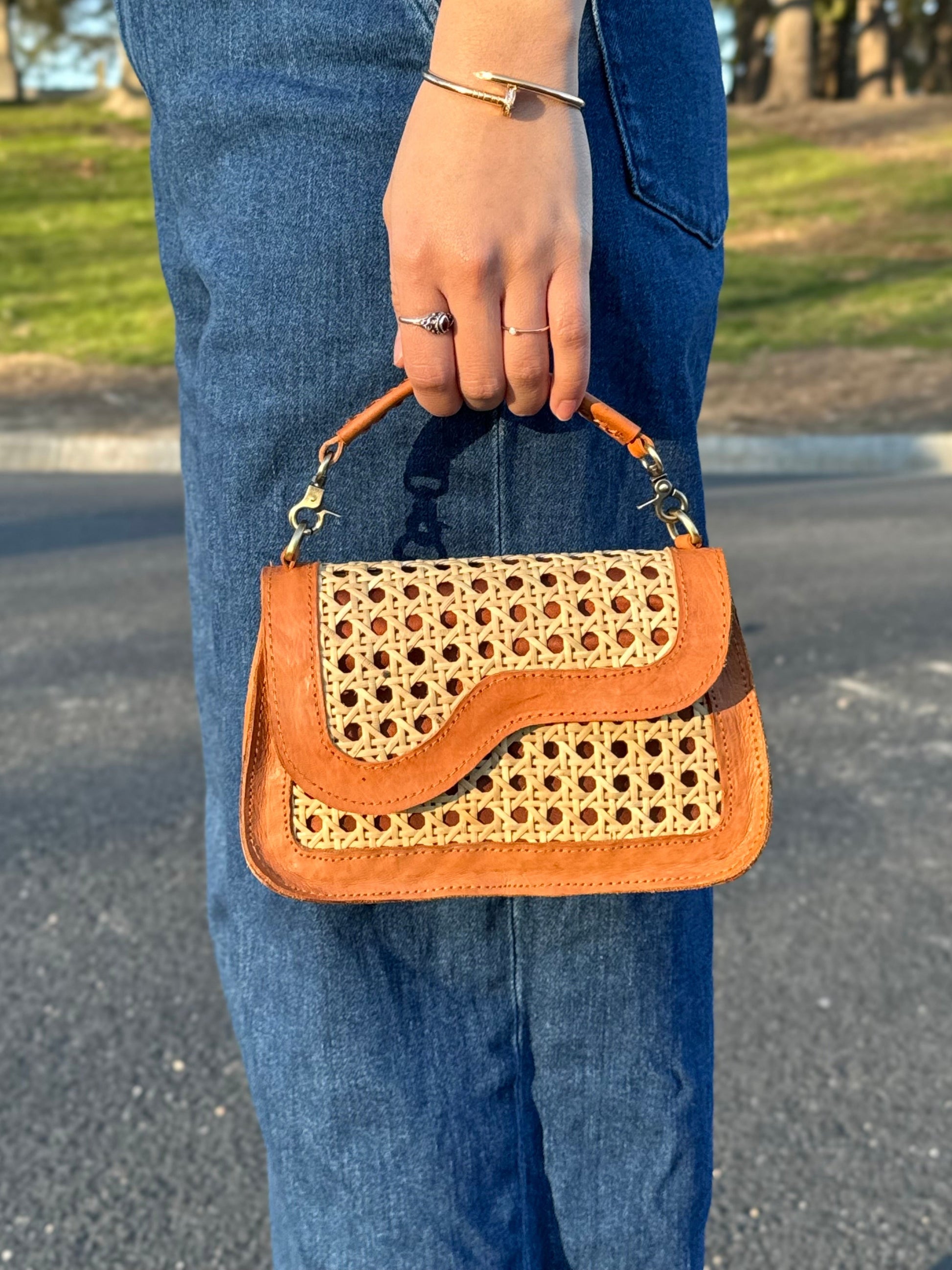 Kate bag held by the top handle 