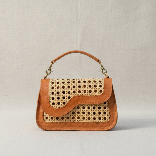 Kate bag held by the top handle 