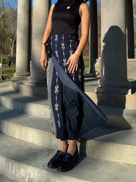 Reversible tenun skirt flapping in the wind showcasing the interior