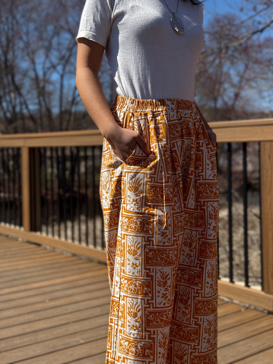 Close up view of Nami barrel pants in yellow.
